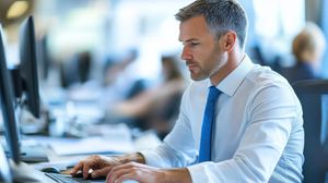 Businessman sitting at a computer