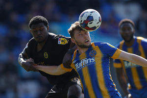 Matthew Pennington of Shrewsbury Town and Ephron Mason-Clark of Peterborough United (AMA)