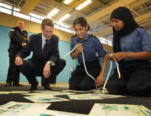 The Defence Secretary with two of the cadets