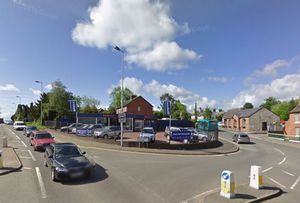 A former car showroom and van hire business in Bayston Hill has gone up for sale.