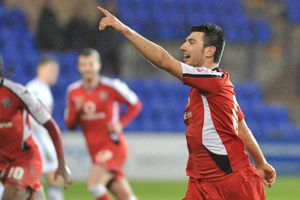 Michael Cain celebrates after scoring a vital goal for Wembley-bound Walsall at Tranmere in the JPT Trophy.