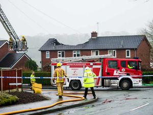 Supporting image for story: Pictures and video: 30 firefighters tackle blaze which leaves hole in house roof near Oswestry