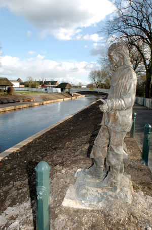 The Izaak Walton statue on the banks of the River Sow in Victoria Park, Stafford