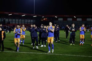 Shrewsbury Town's players celebrate the win at Salford City