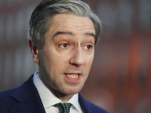 Headshot of Simon Harris speaking