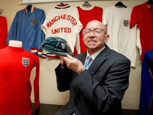 World Cup winner Nobby Stiles holds his 1966 World Cup tournament cap