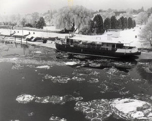The River Severn at Stourport is dotted with chunks of ice, while the nearby amusement park stands deserted
