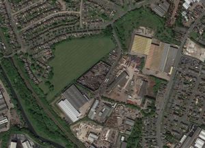 The land off Budden Road, centre, is the location for the new travellers transit site is close to homes and businesses