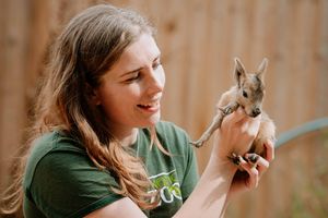 Sam Jones holding a baby Patagonian Mara