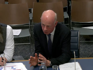 Mr Justice McAlinden, president of the Victims' Payments Board, gives evidence to the Stormont Executive Committee