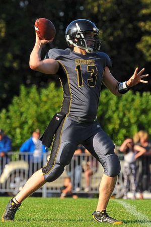Steelers quarterback Josh Bartimus lines up a pass.