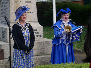 Llandrindod Wells Town Crier Jan Swindale reading the proclamation watched by town Mayor Councillor Marcia Morgan