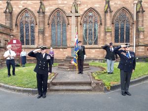 Veterans paid their respects at safe distances outside St Nicholas Church, Newport