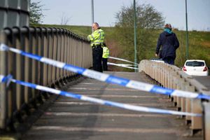 Police and tape at the scene of the incident on Bentley Lane Bridge