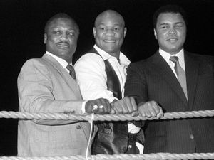 Former world heavyweight champions Joe Frazier, George Foreman and Muhammad Ali, left to right