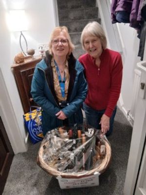 Gil presents the prize to Penkridge resident Sue