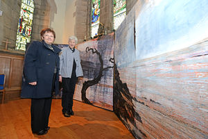 Rev Paula Smith and Josie Edwards admire the famous Jake Lever painting at St Matthew's Church, Donnington Wood