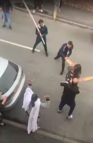 A woman is hit in the face with a cricket bat. Video: Khan Hussain/YouTube