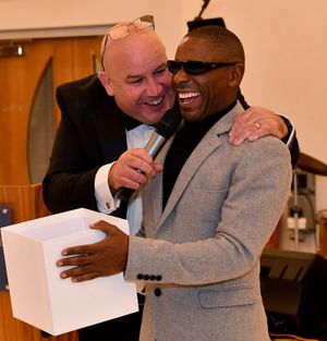 Dicky Dodd jokes with guest speaker Darren Harris.