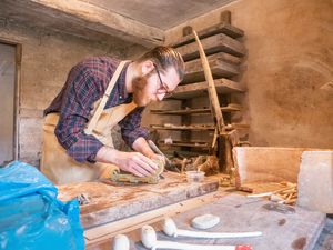 Oliver Meeson doing a pipe making demonstration at Broseley Pipeworks