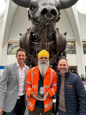 Manny Singh Kang poses with his award alongside Steve Clamp and Martin Colmey (operations director at Network Rail)