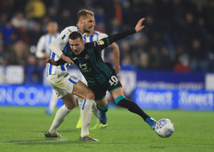 Huddersfield Town's Jon Gorenc Stankovic and Swansea City's Bersant Celina