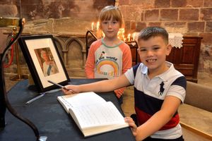 Timothy Whateley, seven, and eight-year-old Liberty Preston signed the book of condolence