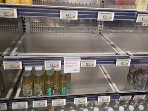 A Marks & Spencer shelf with a notice highlighting availability issues in a store in Paddington, London