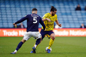 West Bromwich Albion's Andy Carroll (right) and Millwall's Jake Cooper battle for the ball