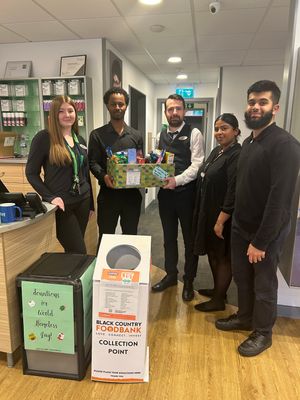 Local Specsavers team Abby Jones, Ibrahim Osman, Michael Joyce, Kiren Mattu and Hameed Begum collect items for Black Country Foodbank