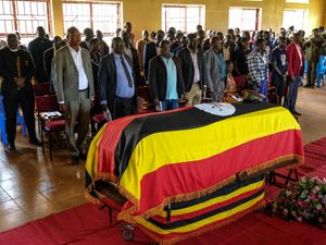 Supporting image for story: Thousands attend military funeral for Ugandan athlete set on fire by partner