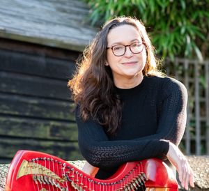 Karen Marshalsay with one of her harp collection