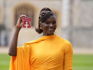 Dina Asher-Smith after being made a Member of the Order of the British Empire (MBE) by the King at an investiture ceremony at Windsor Castle, Berkshire