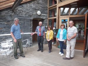 Opening ceremony with from left: David McGlade, Knighton Mayor Councillor Tom Taylor and three people waiting for him to cut the ribbon which was toilet roll