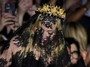 Supporting image for story: Madonna makes veiled entrance to Dolce & Gabbana for show marking 1990s heyday
