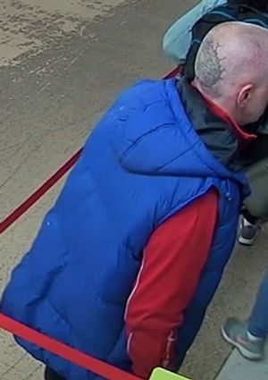 The suspect's tattoo is clearly visible