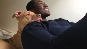 Hosea with his beloved pet dog before he was taken