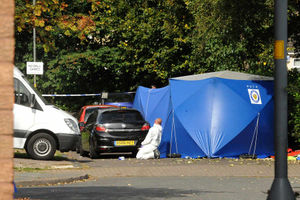 Forensic officers search for clues at the murder scene in Treynham Close, Wolverhampton.