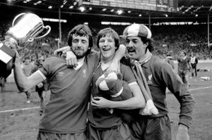 (L-R) Liverpool's Mark Lawrenson, Ronnie Whelan and Bruce Grobbelaar celebrate winning the Milk Cup.