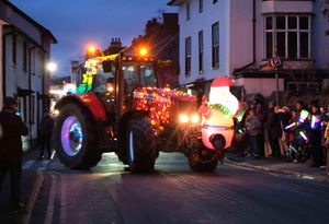 A very festive tractor with Santa’s on the front and back leaves the Cattle Market on the extended tractor run tour. Image by Andy Compton