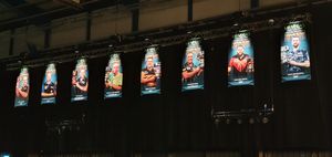 The previous winners look out over the arena. At least three of them are competing in the 2024 tournament