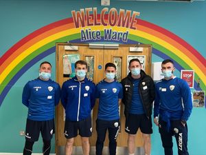 Supporting image for story: Football players prove winners when they drop into children's ward