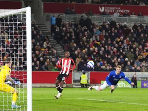 Jake O’Brien dives to head past the Brentford goalkeeper