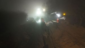 The final stricken canal boat, Sefton, being winched from the Whitchurch breach. Picture: Court Above the Cut