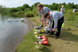 People touched by the tragedy leave tributes at the scene today