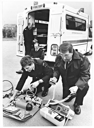 Paramedics from across Staffordshire returned to full-time work without waiting for the results of a national ballot, and the first call for Nigel Purnell (front left) and Trevor Jones (front right) from Cannock was to motorist who was injured when their Ford Escort car overturned in Burntwood. March 4, 1990.