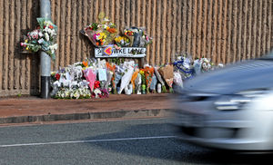 Floral tributes at the scene of the fatal crash on Powke Lane.
