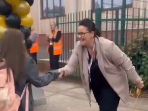 Supporting image for story: School principal and therapy dog greet every new pupil on first day of term 