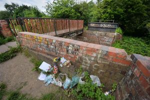 Tributes remain near the canal where the baby boy was found