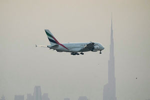 An Emirates plane prepares for landing at Dubai International Airport. (Photo by AFP via Getty Images)